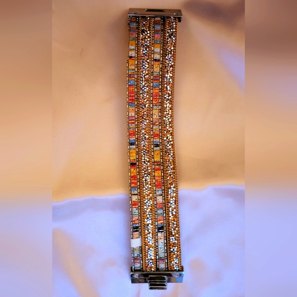 Beaded cuff in orange tones